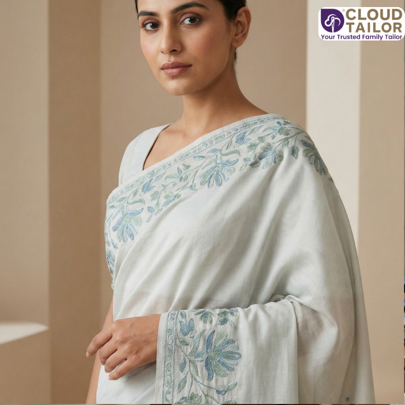 Soft pastel saree featuring elegant Saree Embroidery along the border.